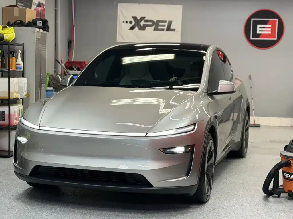 Tesla Model Y L with XPEL PRIME ceramic window tint inside Exclusive Paint Protection's Charlotte studio